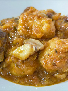 A picture of Meatballs with Mushrooms in Sauce.