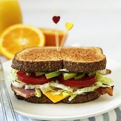 A picture of Bacon, Ham, Avocado, & Cheese Sandwich.