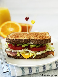 A picture of Bacon, Ham, Avocado, & Cheese Sandwich.