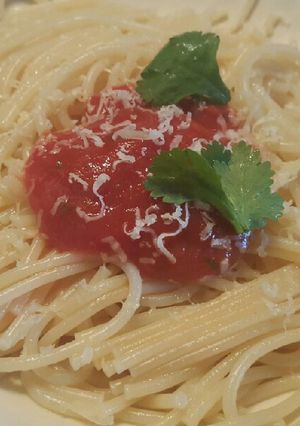 A picture of Spaghetti with tomato sauce and cheddar cheese 😍.