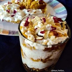 A picture of Layered ghevar dessert glass.