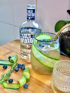 A picture of Gin with blueberry & cucumber syrup cocktail.