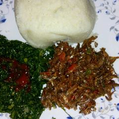 A picture of Fried sardines(omena), skuma wiki and Ugali.