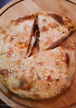 A picture of Aloo Cheese Naan.
