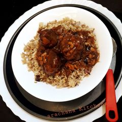 A picture of Veg manchurian with fried rice.