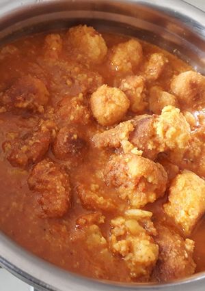 A picture of Chana dal and potato balls gravy.
