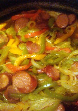 A picture of sausages and peppers.