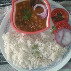 A picture of Punjabi style chole with rice.