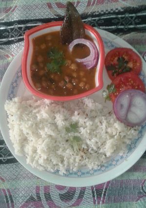 A picture of Punjabi style chole with rice.