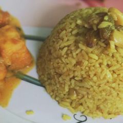 A picture of Basanti Pulao / Bengali sweet yellow rice.