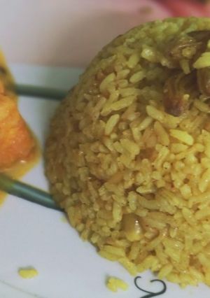A picture of Basanti Pulao / Bengali sweet yellow rice.