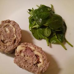 A picture of Polpettone - Italian meatloaf with parma ham and cheese.