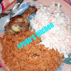 A picture of Jollof rice with salad.