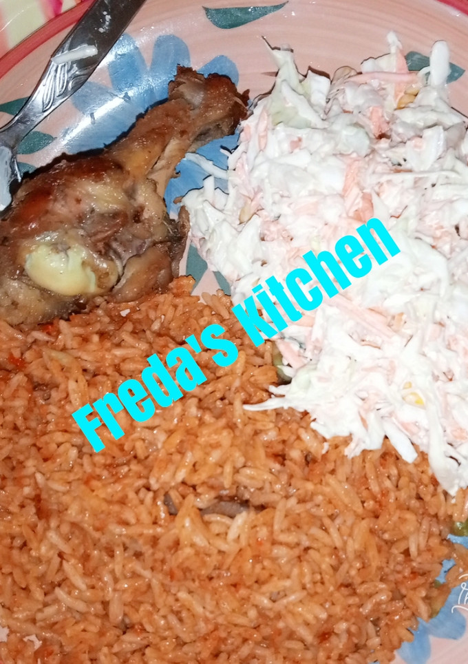 A picture of Jollof rice with salad.