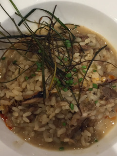 Una foto de Arroz meloso de pato y setas