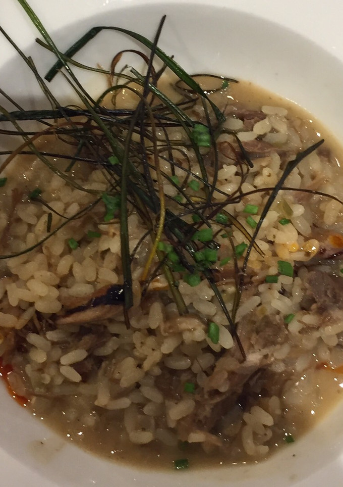 Una foto de Arroz meloso de pato y setas
