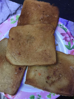 A picture of Fried bread wit egg.