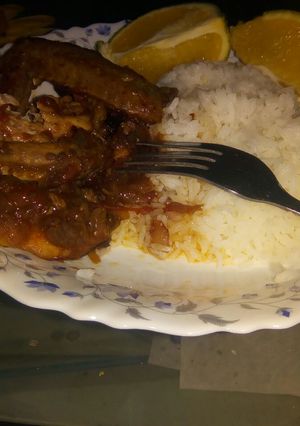 A picture of Boiled rice with fried chicken.