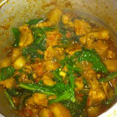 A picture of Pork with rai saag(mustard leaves).