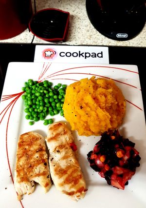 A picture of My Grilled Chicken with Butternut Squash Potatoes and cold Salad.