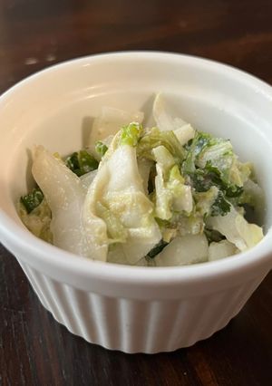 A picture of Nappa cabbage salad with tofu Caesar dressing.