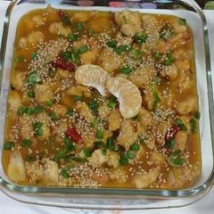 A picture of Orange chicken sprinkle sesame seeds.