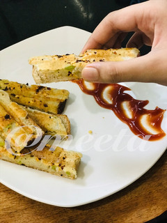 A picture of Cheesy Sooji Toast Fingers.