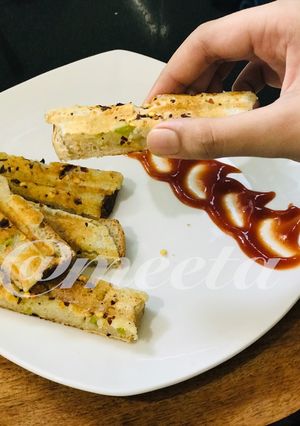 A picture of Cheesy Sooji Toast Fingers.