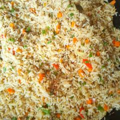 A picture of Garnished jollof rice.
