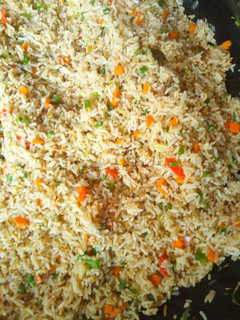 A picture of Garnished jollof rice.