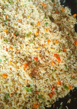 A picture of Garnished jollof rice.