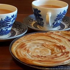 Tea with crispy laccha paratha A picture of Tea with crispy laccha paratha.