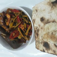 A picture of Roasted yam with ugba sauce.