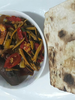 A picture of Roasted yam with ugba sauce.