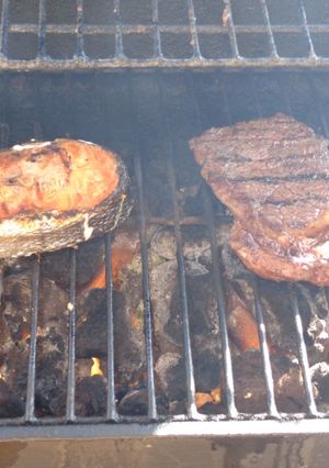 A picture of Grilled Steak and Salmon with Herb Butter.