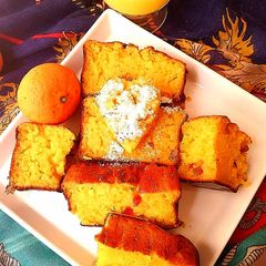 A picture of Eggless Orange  tuttifrutti Cake.