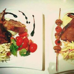 A picture of Roasted rack of Lamb with Creamy Potato Mash topped with chives.