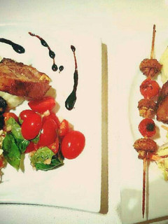 A picture of Roasted rack of Lamb with Creamy Potato Mash topped with chives.