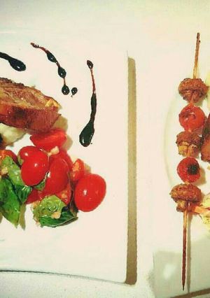 A picture of Roasted rack of Lamb with Creamy Potato Mash topped with chives.