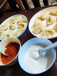 A picture of Chicken Momos or dumplings.