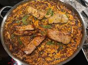 Una foto de arroz confit de pato