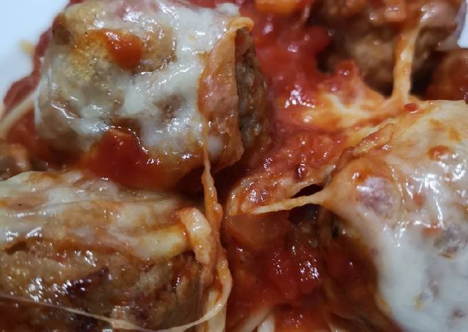 Mozzarella pork meatballs over spaghetti
