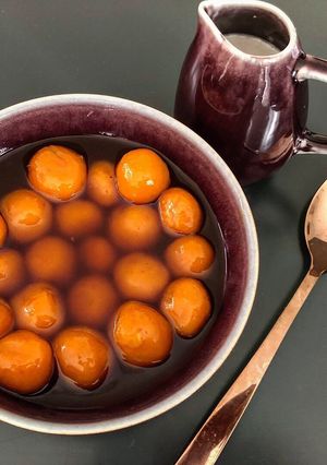 A picture of Kolak Biji Salak - Sweet potato balls in palm sugar syrup and coconut milk.