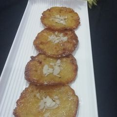 A picture of Wheat flour rabdi malpua.
