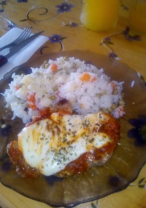 Una foto de Bondiola a la pizza con arroz fresco.🍽️🍽️