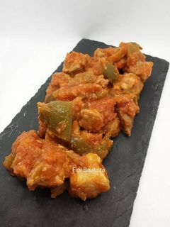Una foto de Magra de cerdo con tomate