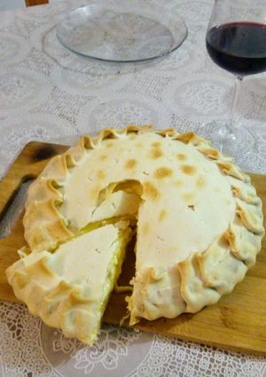 Una foto de Tarta de cebolla y quesos
