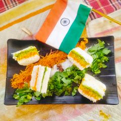 A picture of Tricolour sandwich 🥪 coconut green Chutney / RAW Turmeric coconut chutney sandwiches 🥪.
