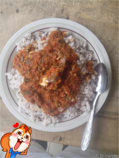A picture of Rice and beans with fish stew.