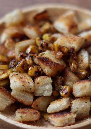 A picture of Homemade croutons and sweet corn toppings 🌽.